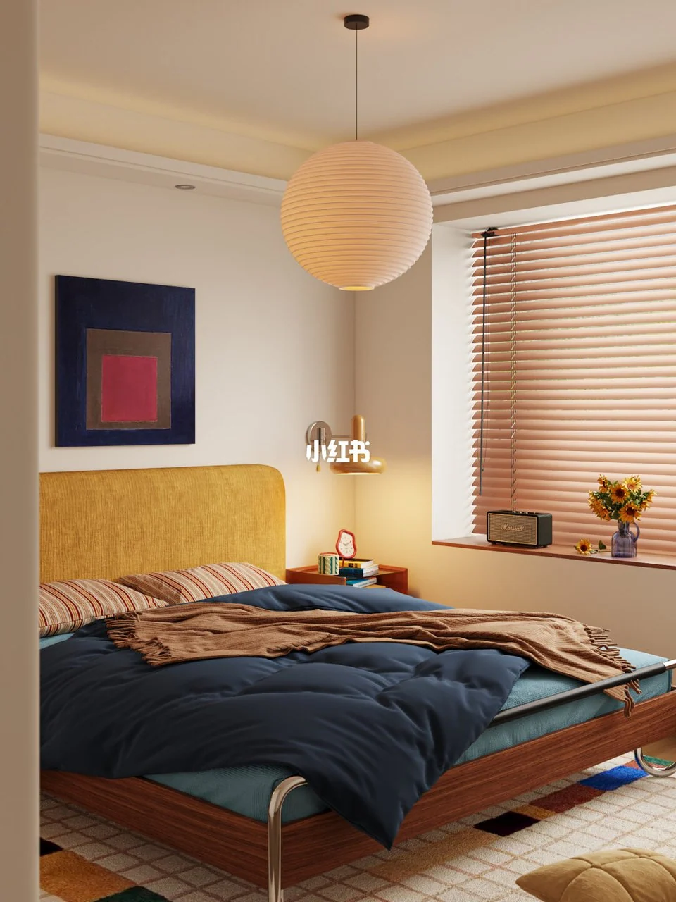 Mustard headboard, navy bedding, striped pillows, wood blinds and a large paper pendant in a warm bedroom.