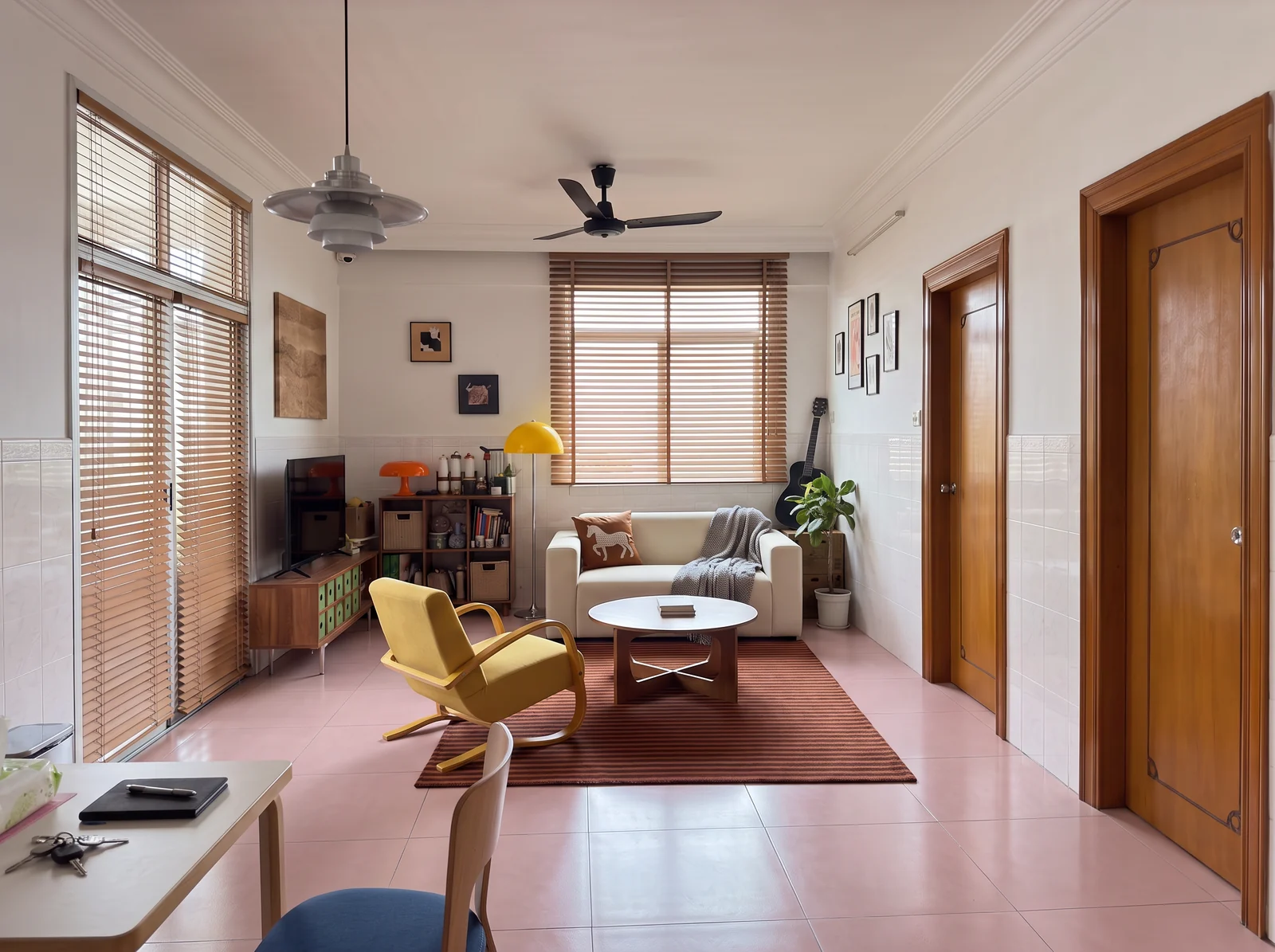 Proposed warm bentwood direction with ivory sofa, mustard chair, striped rug and wood blinds in a pink-tile room.